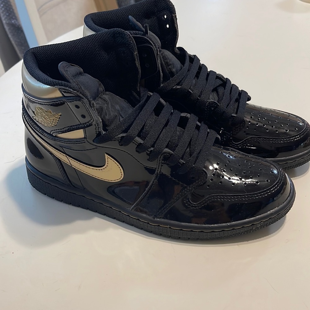 Nike Air Jordan black and gold high top